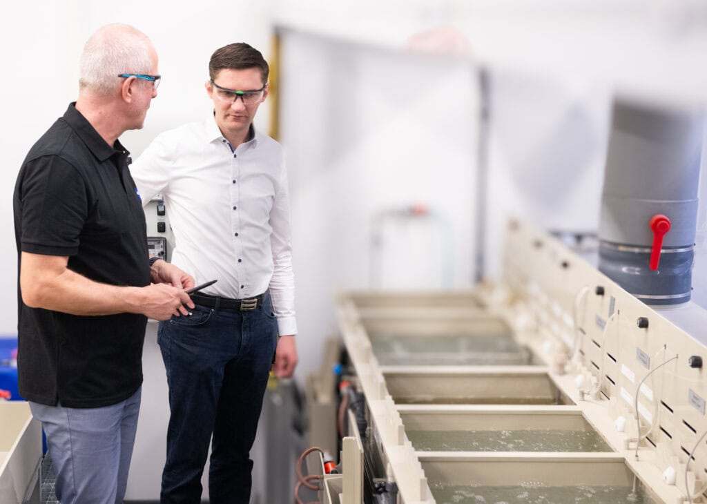 Consultants inspect the washbasins at an electroplating plant