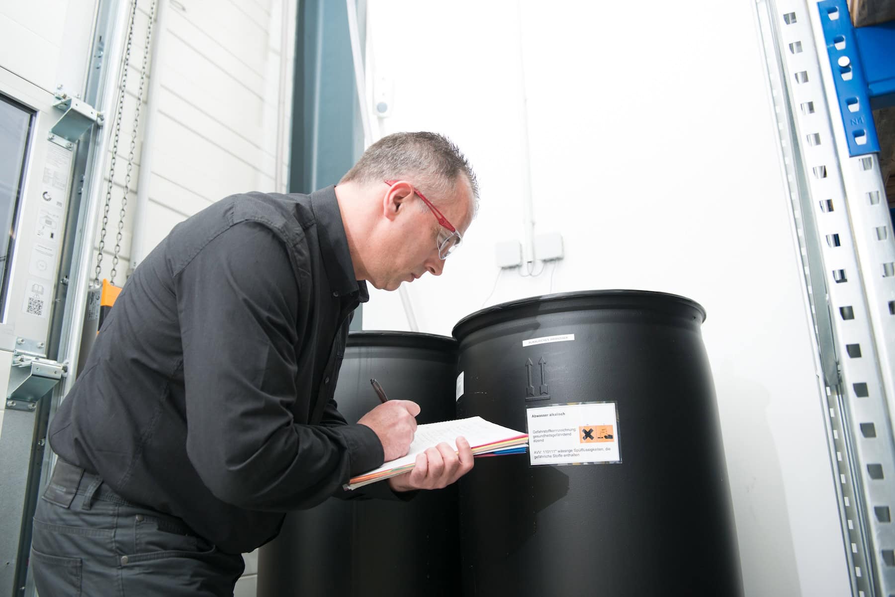 Surveyor documents the barrels in the warehouse